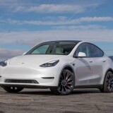 tesla-model-y-2022-06-exterior-front-angle-sedan-white-scaled